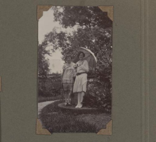 Two women of the Jetten family of Moengo, one of them with a parasol
