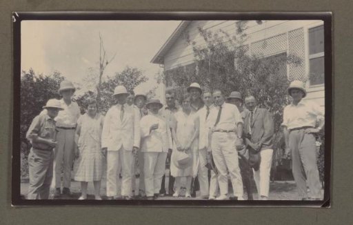 Group photograph in front of a house