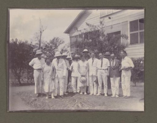 Group photograph in front of a house