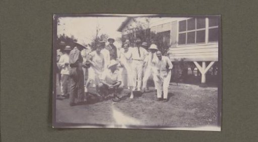Group photograph in front of a house