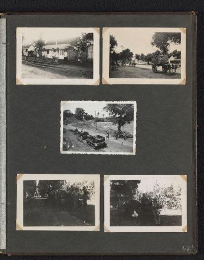 Villagers and military vehicles