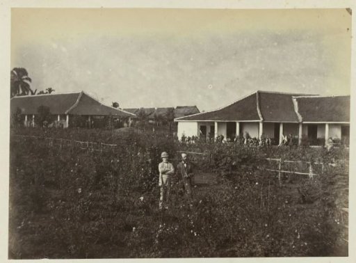 Two Men in Front of a Building