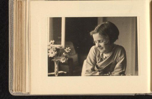 Isabel Wachenheimer at a table with a vase of flowers, 1931-1937, Stuttgart / Passport photo of Isabel