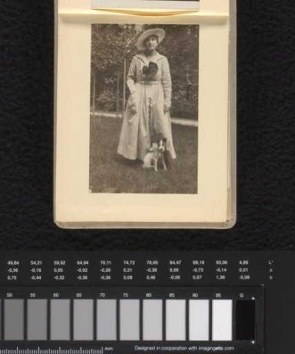 Else Wachenheimer-Moos in the garden with a dog, 1920-1935, Germany?