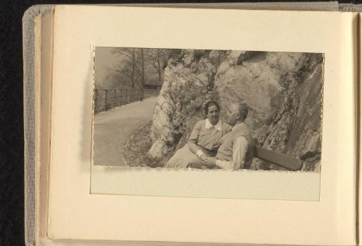 Else Wachenheimer-Moos sitting with her husband Eugen Wachenheimer on a bench before a rock formation during a holiday, 1922-1937, Germany/Switzerland/Austria?