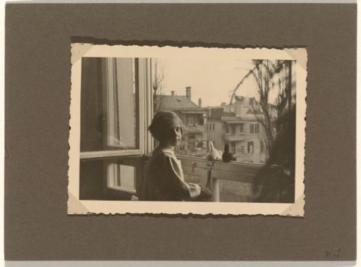 Isabel Wachenheimer with plush animals by an open window, June 1934