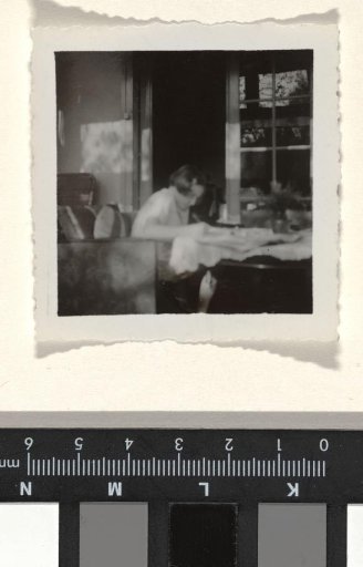 Isabel Wachenheimer seated in a chair working at a table