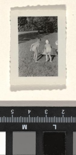 Isabel Wachenheimer with Two Unknown Children at a Bath Tub in a Garden