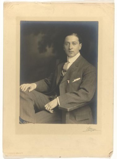 Arthur Moos, seated in a chair, in civilian clothing, 1905-1922