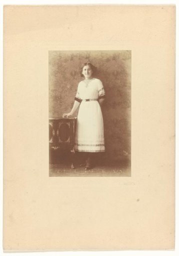 Else Wachenheimer-Moos as a young woman by a cabinet, 1905-1920