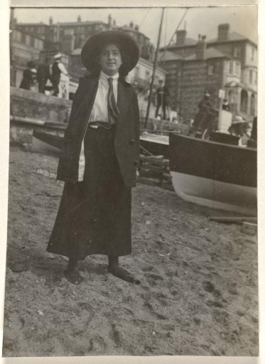Else Wachenheimer-Moos with a hat in front of a boat on the beach, Bexhill-on-Sea, 1913