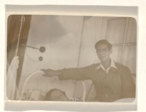 Isabel Wachenheimer lying in a hospital bed in the sanatorium Etania in Davos, with an unknown man beside her bed, 12 August 1945