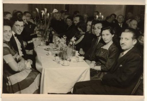 Table with Festively Dressed Unknown People Seated at a Table, 1945-1955