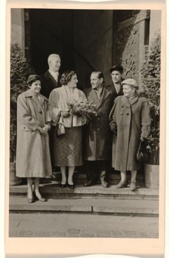 Isabel Wachenheimer and Gideon Elon on their wedding day with four unknown people at the entrance of a church, 10 March 1956