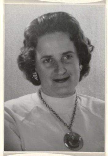 Isabel Wachenheimer with a turtleneck and a necklace with musical notes around her neck, looking forward