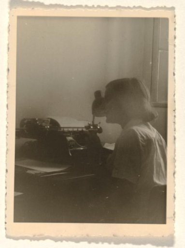 Isabel Wachenheimer seated behind a typewriter