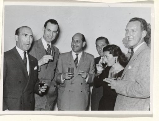 Gideon Elon with four unknown men and an unknown woman, during a reception during Isabel Wachenheimer's time with KLM