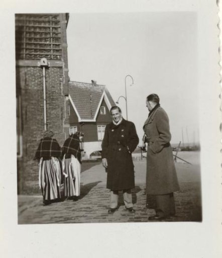 Gideon Elon, the third husband of Isabel Wachenheimer, in a Dutch city alongside two women in Dutch traditional dress and an unknown man