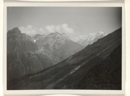Snowy mountain landscape with clouds in the background