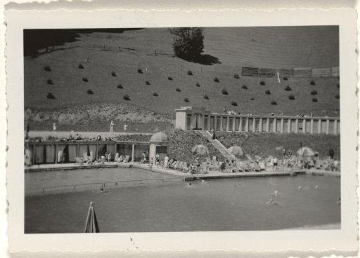 Swimming pool in the Swiss town of Engelberg, with a wooded hill in the background