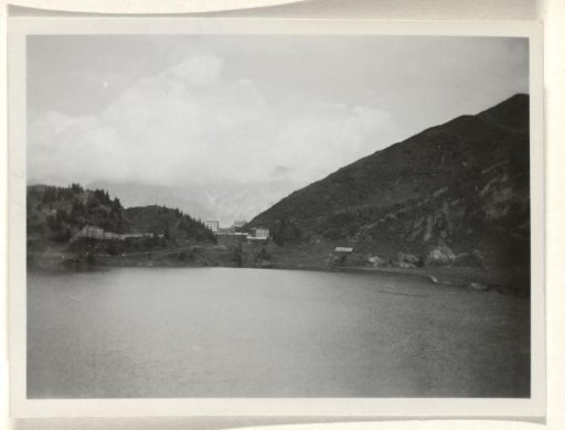 Hotel near the Swiss town of Engelberg, viewed from the lake, with mountains in the background