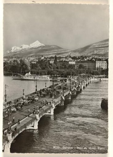 Bridge with traffic over a river in Geneva, with the Mont Blanc and buildings in the background