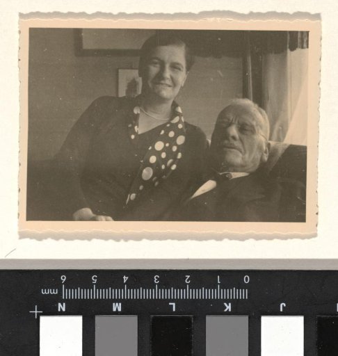 Meir Wachenheimer and his wife Mathilde Wachenheimer-Wertheimer, reclining against a sofa with part of a lamp and a painting visible in the background