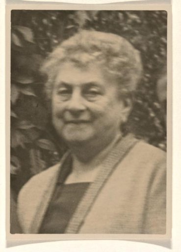Portrait of Josefine Moos-Levi, dressed in a gown with vertical stripes