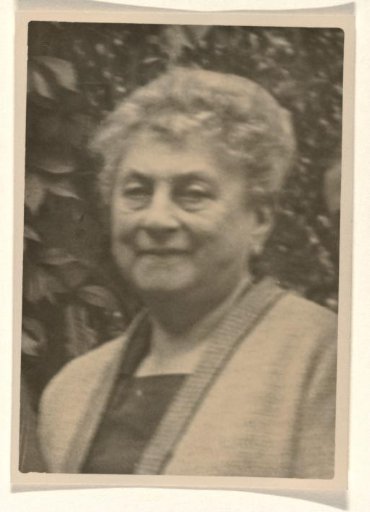 Portrait of Josefine Moos-Levi, dressed in a gown with vertical stripes