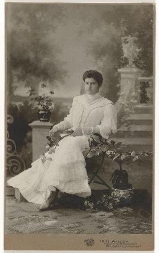 Mathilde Wachenheimer-Wertheimer as a young woman seated before a set with a staircase