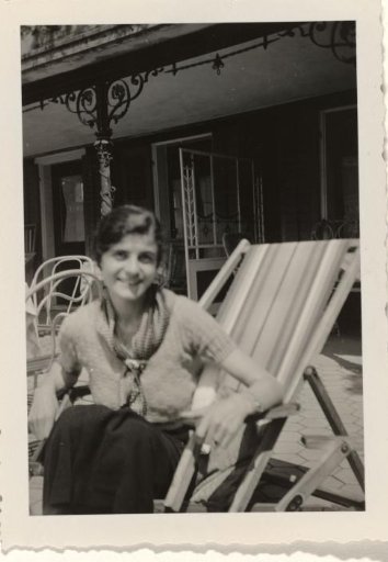 Member of the household staff of the Wachenheimer family, seated in a deck chair on a terrace during a Wachenheimer family holiday in Switzerland