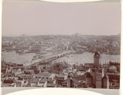 Istanbul with a bridge in the middle and a tower with a dome on the right side