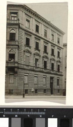 Side view of an apartment building, containing four unknown people
