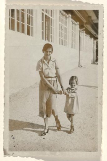 Isabel Wachenheimer walking hand-in-hand with an unknown member of the household staff, near a hotel by the Eibsee