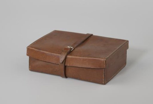 Small brown leather suitcase