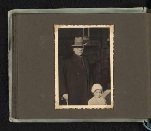 Isabel Wachenheimer on the street with her grandfather Meir Wachenheimer, autumn–winter