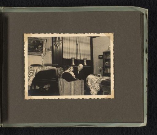 Isabel Wachenheimer on her mother Else Wachenheimer-Moos's lap with her grandfather Meir Wachenheimer in the chair beside her
