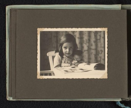 Isabel Wachenheimer reading a book at a table in the Wachenheimer family home