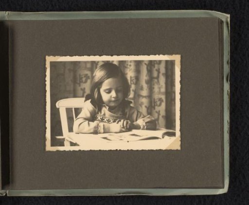 Isabel Wachenheimer reading a book at a table in the Wachenheimer family home