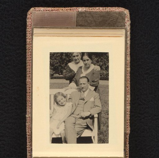 Isabel Wachenheimer on the sofa with her uncle Willy Moos, and her mother Else Wachenheimer-Moos and an unknown woman in the background, July-August 1933, Hamburg