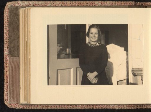 Isabel Wachenheimer standing before an open door, July–September 1933, Hamburg