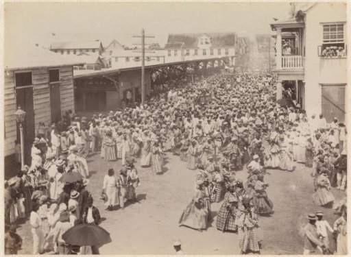 Procession of a group of women along the Waterkant in Paramaribo