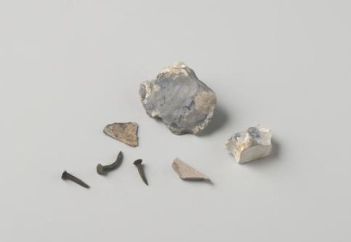 Nails, flint, stoneware shard, and tin or lead fragment from the wreck of the East Indiaman Hollandia