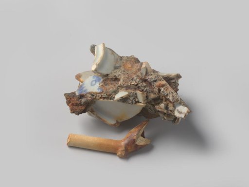 Concretion fragment with inclusions of natural stone and porcelain and a fragment of a pipe from the wreck of the East Indiaman Hollandia