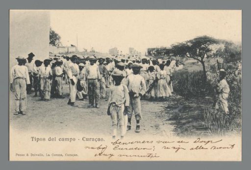 Large group of young people on and by an unpaved road in Curaçao