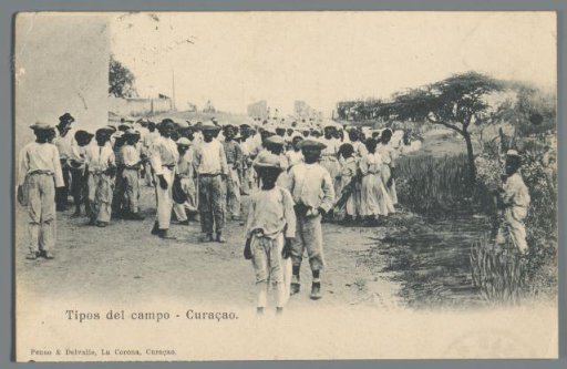 Large Group of Young People on and by an Unpaved Road in Curaçao