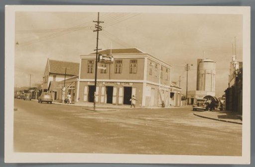 View of a shop building on a street corner on Aruba