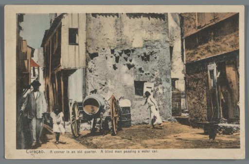 Curaçao / A corner in an old quarter / A blind man passing a water car