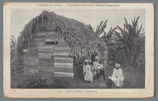 View of a house with its inhabitants in the Antilles