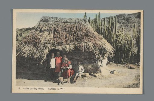 View of a family in front of their house on Curaçao